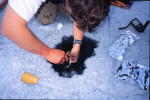 Mike Mazur using bent spoon and turkey baster to recover meteorites.